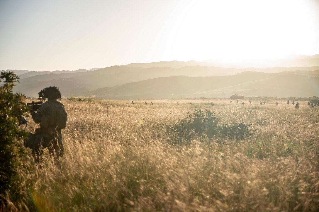 U.S. Marines with Apache Company, 1st Battalion, 5th Marine Regiment, 1st Marine Division, conduct a patrol during a simulated raid during 1/5’s MCCRE at Marine Corps Base Camp Pendleton, April 20, 2023. The purpose of a MCCRE, is to formally evaluate the unit’s core and/or assigned mission essential tasks to ensure service standardization and combat readiness. (U.S. Marine Corps photo by Cpl. Patrick Katz)
