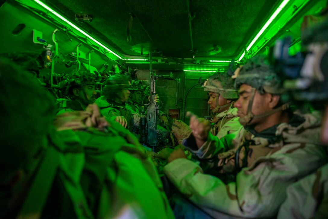 U.S. Marines with Apache Company, 1st Battalion, 5th Marine Regiment, 1st Marine Division, and Marines with 1/5, conduct a movement in an A1 AAV during 1/5’s MCCRE at Marine Corps Base Camp Pendleton, April 21, 2023. The purpose of a MCCRE, is to formally evaluate the unit’s core and/or assigned mission essential tasks to ensure service standardization and combat readiness. (U.S. Marine Corps photo by Cpl. Patrick Katz)
