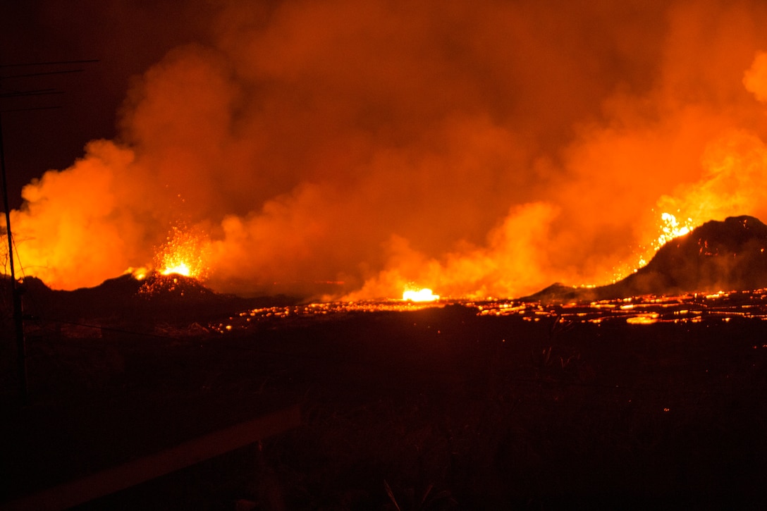 Volcanic fissures spurt out lava and toxic gas in Pahoa, Hawaii May 25, 2018. U.S. Marines remain on standby to evacuate residents in areas heavily affected by the Kilauea volcano eruption. (U.S. Marine Corps photo by Pfc. Trevor Rowett.)