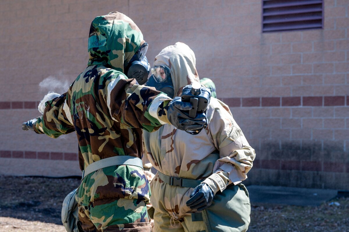 Airman 1st Class Skyler Mcdonalds, a 133rd Civil Engineering Squadron emergency management specialist, right, decontaminates Senior Airman Anna Alger, a 934th Civil Engineering Squadron emergency management specialist, at the Minneapolis-St. Paul Air Reserve Station, Minnesota, April 13, 2023. The operations were part of a joint training exercise between the 934th Airlift Wing and the Minnesota Air National Guard's 133rd AW. (U.S. Air Force photo by Senior Airman Matthew Reisdorf)