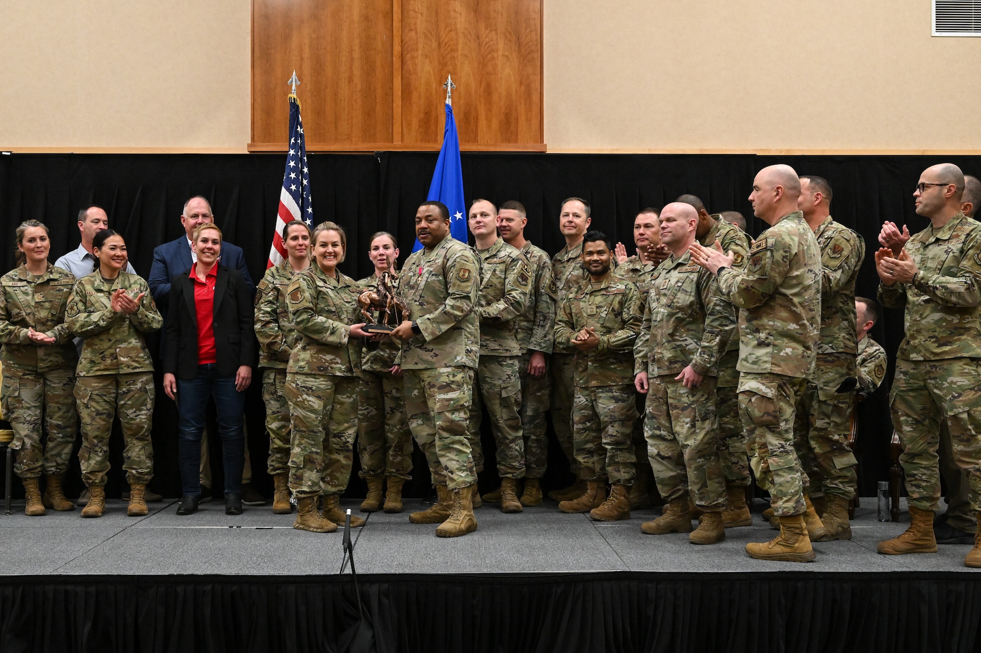 military members standing on a stage