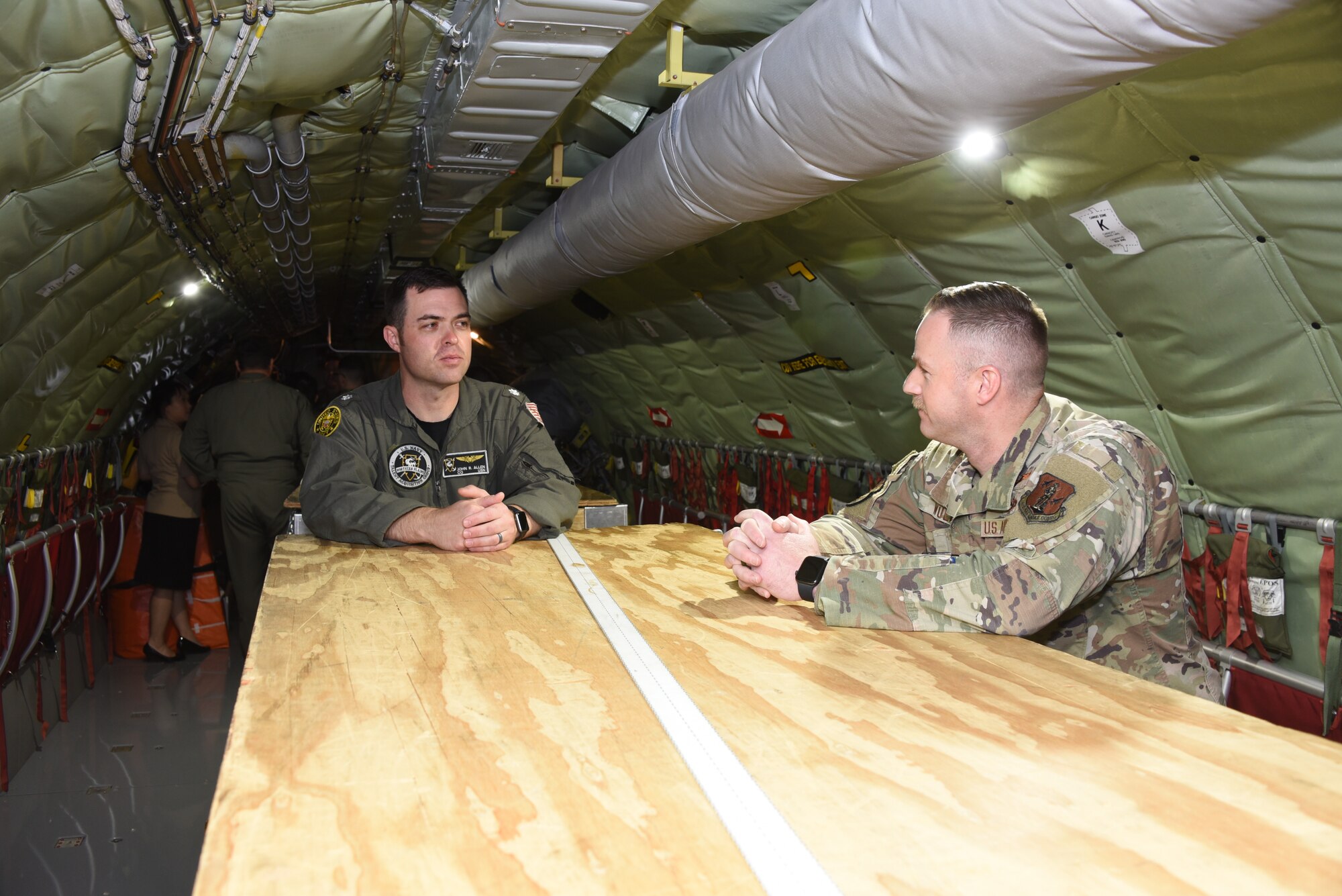 U.S. Navy Commander John Allen talks with Iowa Air National Guard Captain Matt Wulf