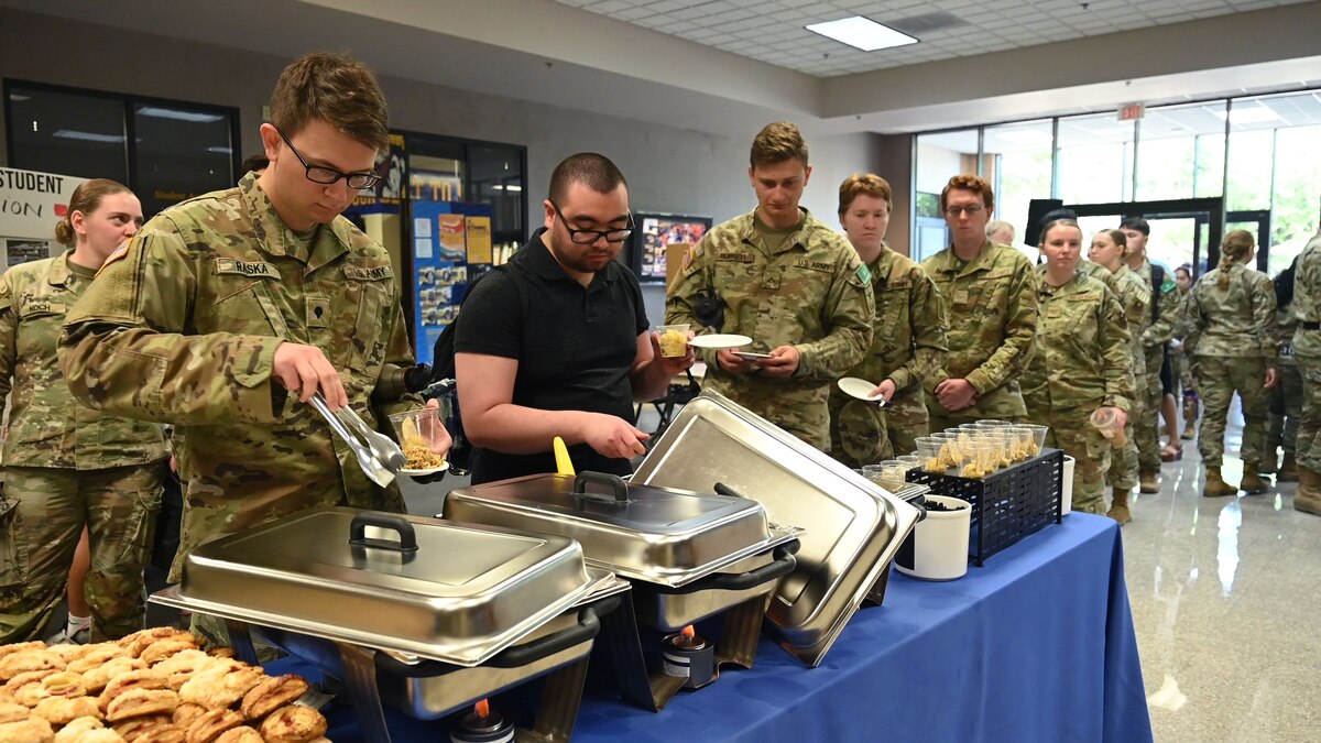 Students assigned to the 17th Training Group and Angelo State University students wait in line for food at the ASU and Goodfellow Air Force Base Language and Culture Fair, San Angelo, Texas, April 27, 2023. This year's fair was titled “Tastes and Traditions.” (U.S. Air Force photo by Airman 1st Class Zach Heimbuch)