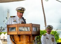 230303-N-NO841-0172 PEARL HARBOR, Hawaii (March 3, 2023) Cmdr. Robert Wells, outgoing commanding officer, Submarine Readiness Squadron 33, speaks during the change of command ceremony for Submarine Readiness Squadron 33 at the Pacific Fleet Submarine Museum, March 3, 2023.  Submarine Readiness Squadron 33 provides operational support for Pearl Harbor homeported submarines, their crews, families, and the staffs of Submarine Squadrons 1 and 7. (U.S. Navy photo by Torpedoman 3rd Class Tommy Heng)