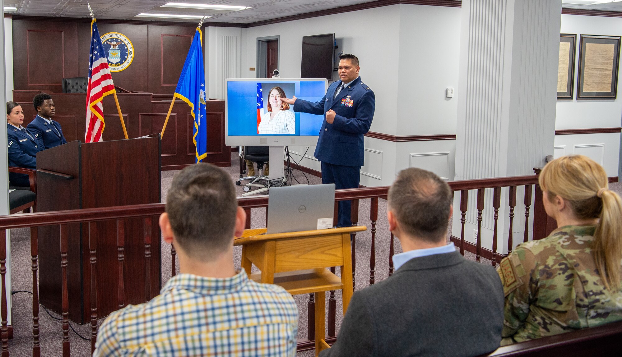 U.S. Air Force Col. Brian Banas, 673d Air Base Wing Judge Advocate staff judge advocate, speaks to gathered coworkers and friends of Kimberly Pfender, a retired U.S. Air Force master sergeant, during a 673d ABW/JA courtroom dedication at Joint Base Elmendorf-Richardson, Alaska, April 6, 2023. Pfender served with distinction as both an Air Force non-commissioned officer and civil servant for a combined federal service of 28 years. (U.S. Air Force photo by
Tech. Sgt. Curt Beach)
