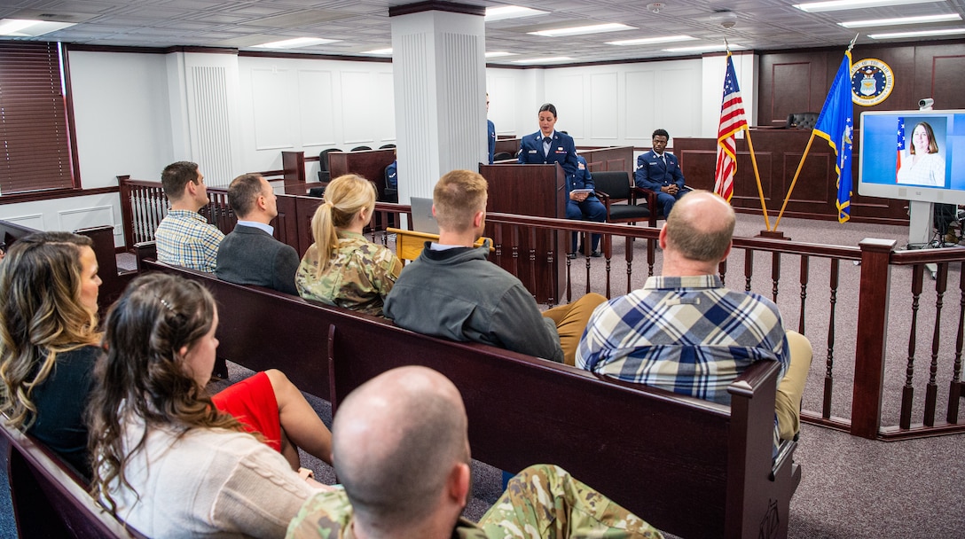 U.S. Air Force Airman First Class Sasha Wolf, 673d Air Base Wing Judge Advocate paralegal, speaks to gathered coworkers and friends of Kimberly Pfender, a retired U.S. Air Force master sergeant, during a 673d ABW/JA courtroom dedication at Joint Base Elmendorf-Richardson, Alaska, April 6, 2023. Pfender served with distinction as both an Air Force non-commissioned officer and civil servant for a combined federal service of 28 years. (U.S. Air Force photo by
Tech. Sgt. Curt Beach)