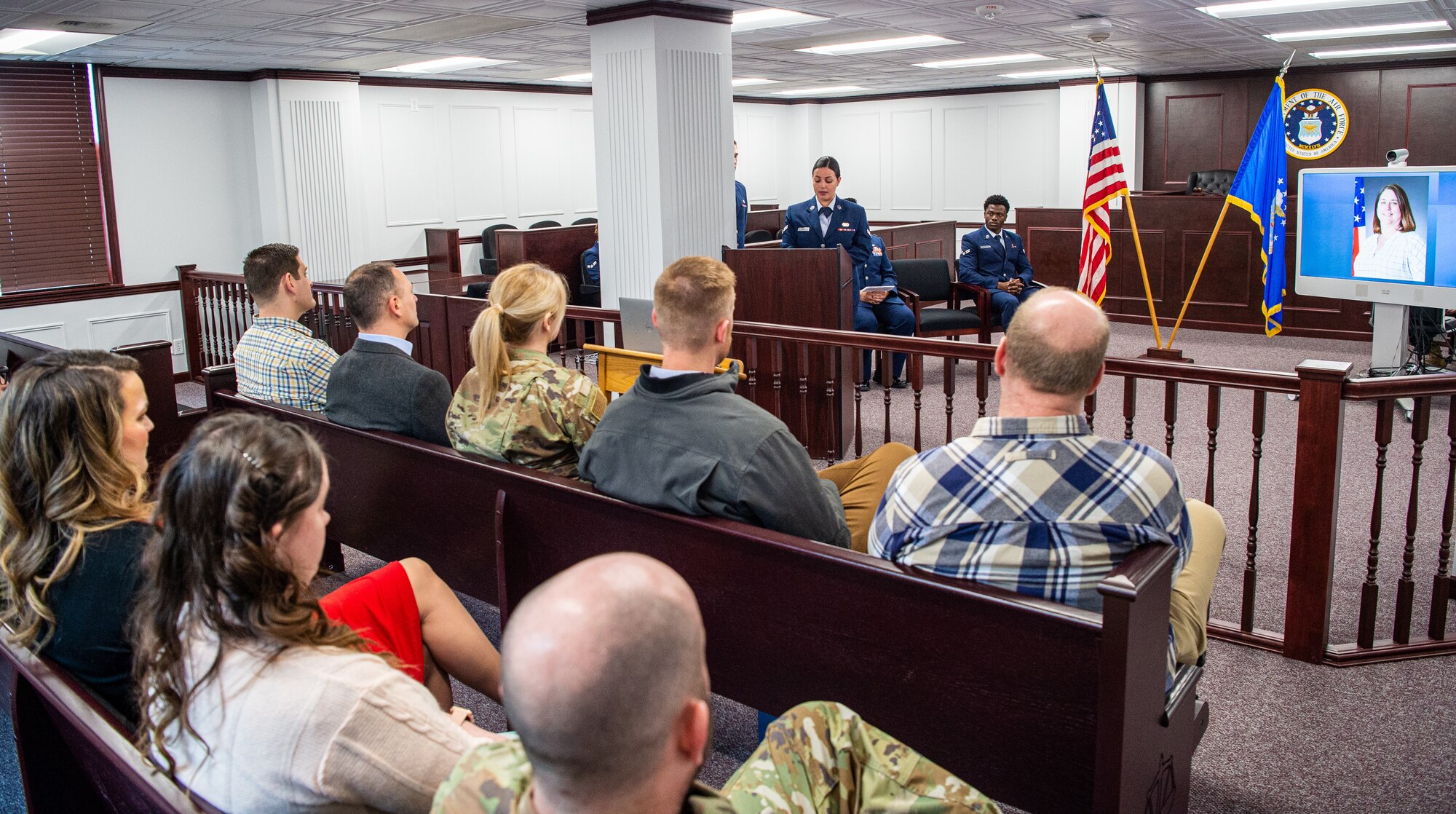 U.S. Air Force Airman First Class Sasha Wolf, 673d Air Base Wing Judge Advocate paralegal, speaks to gathered coworkers and friends of Kimberly Pfender, a retired U.S. Air Force master sergeant, during a 673d ABW/JA courtroom dedication at Joint Base Elmendorf-Richardson, Alaska, April 6, 2023. Pfender served with distinction as both an Air Force non-commissioned officer and civil servant for a combined federal service of 28 years. (U.S. Air Force photo by
Tech. Sgt. Curt Beach)