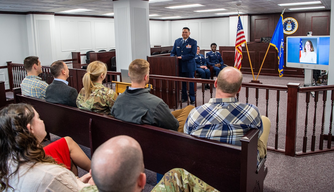 Gathered coworkers and friends attend a dedication ceremony in memory of Kimberly Pfender, a retired U.S. Air Force master sergeant, at a 673d Air Base Wing Judge Advocate courtroom at Joint Base Elmendorf-Richardson, Alaska, April 6, 2023. Pfender served with distinction as both an Air Force non-commissioned officer and civil servant for a combined federal service of 28 years. (U.S. Air Force photo by Tech. Sgt. Curt Beach)