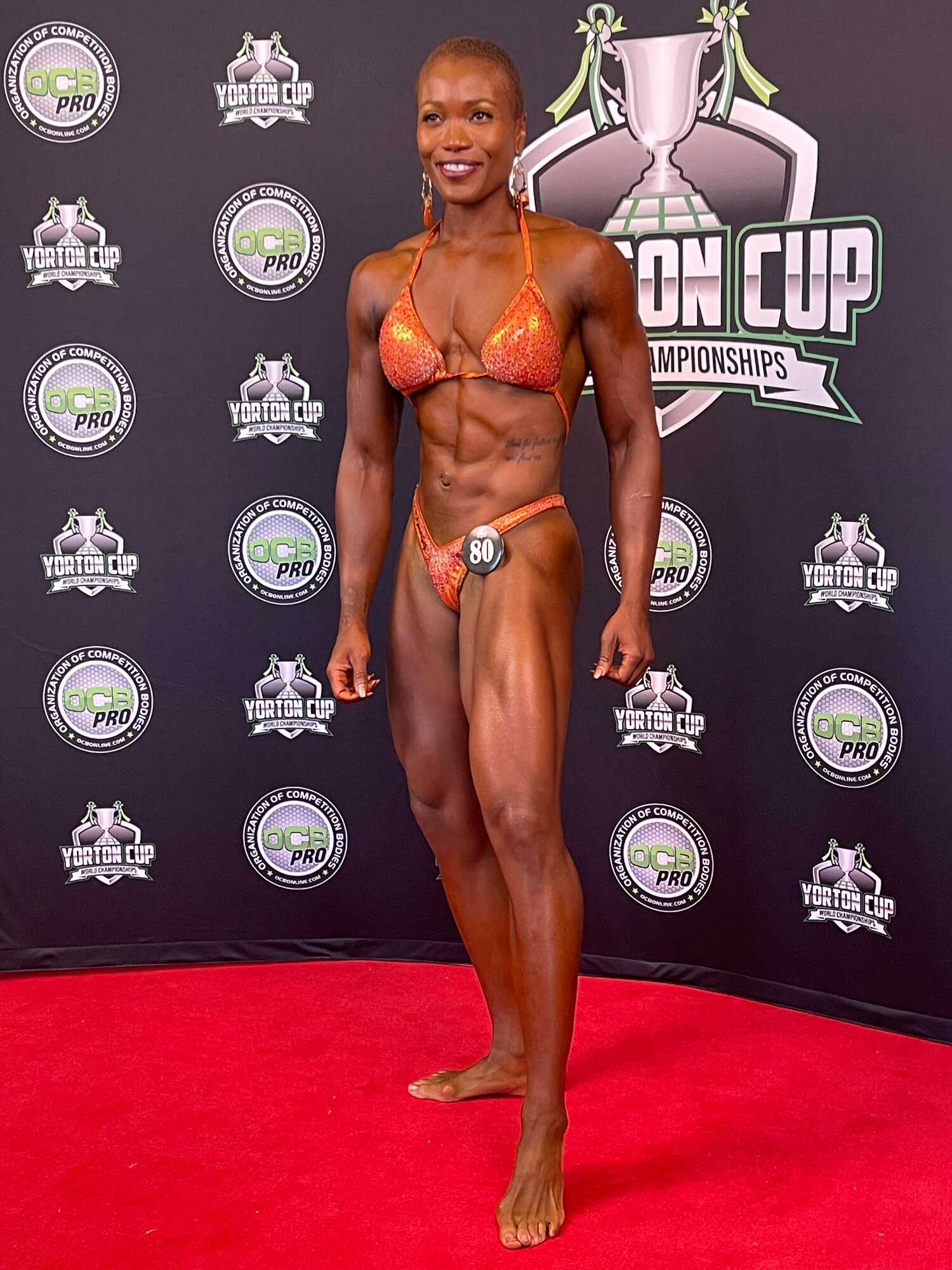 A photo of Danielle Todman posing for a photo at the Organization of Competitive Bodybuilders Yorton Cop World Championship.