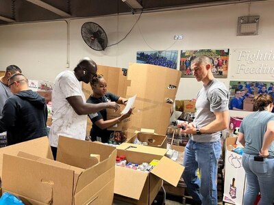 Student airmen and host members of the symposium prepare and package products to offer relief to food-insecure families and unsheltered persons at the San Antonio Food Bank on March 30, 2023. (Courtesy photo)