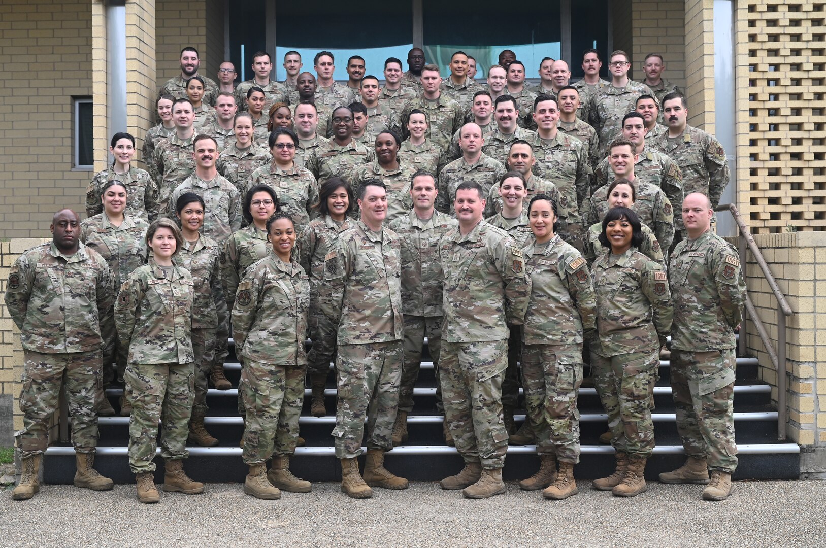 Col. Richard Erredge, commander of the 960th Cyberspace Wing, Chief Master Sgt. Christopher Howard, and 960 CW First Sergeants pose for a photo alongside the student airmen of the symposium at Joint Base San Antonio-Lackland, Texas on March 27, 2023. (U.S. Air Force photo by 2nd Lt. Alex Dieguez)