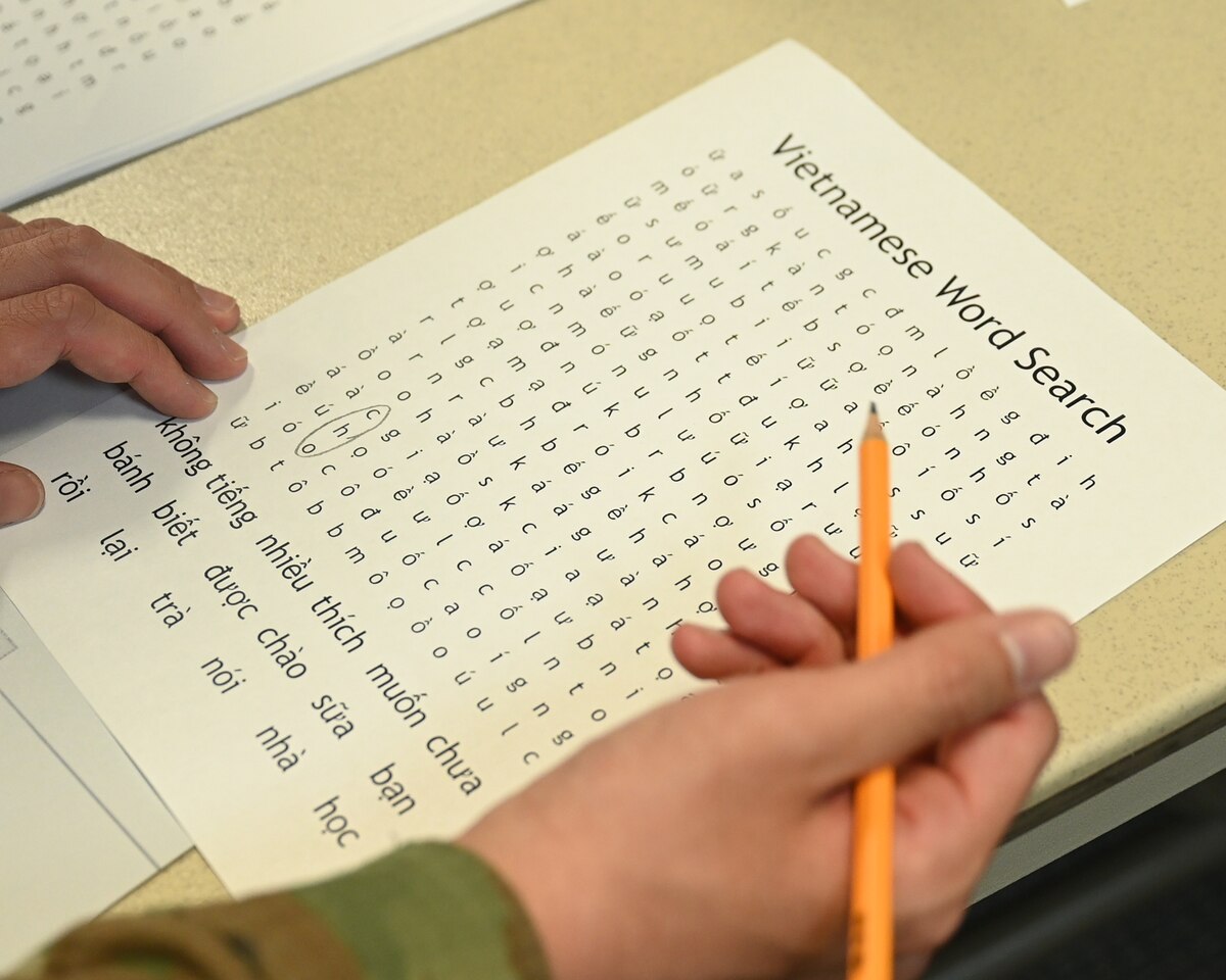 A 17th Training Wing member completes a Vietnamese word search at Angelo State University and Goodfellow Air Force Base International Language and Culture Fair in San Angelo, Texas, April 27, 2023. The attendees learned about different languages and they experienced different cultures from where that language was spoken. (U.S. Air Force photo by Airman 1st Class Zach Heimbuch)