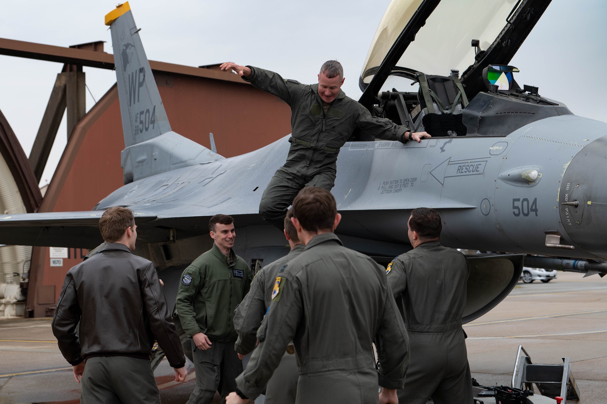 Col. John Caldwell, 8th Fighter Wing vice commander, leaps from the cockpit of a F-16 Fighting Falcon after completing his fini-flight at Osan Air Base, Republic of Korea, April 25, 2023.