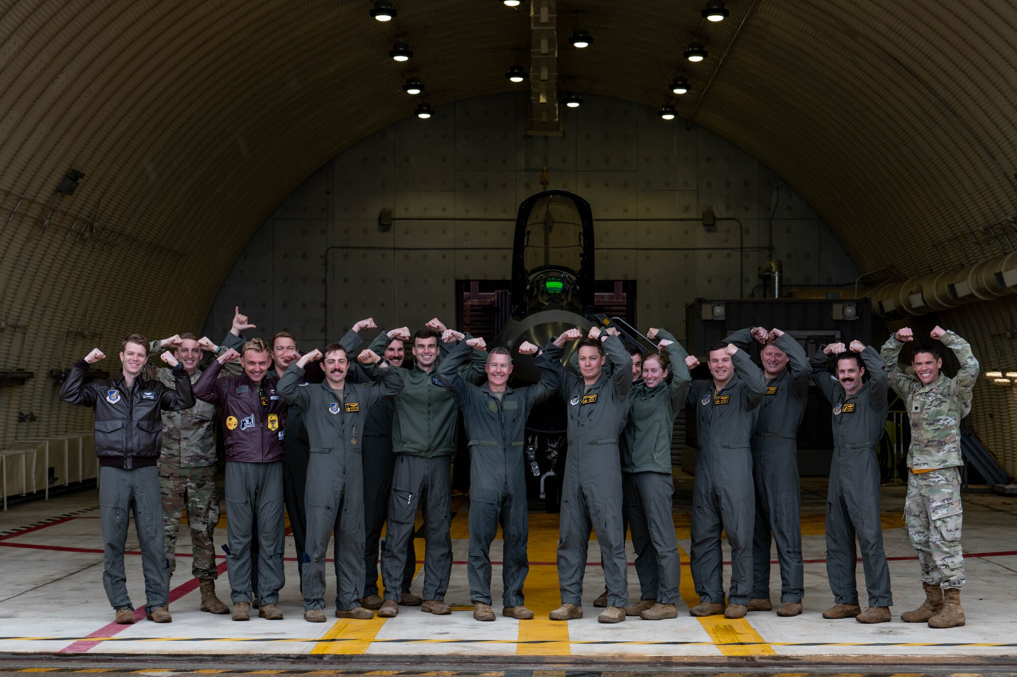Col. John Caldwell (center), 8th Fighter Wing vice commander, stands alongside Kunsan Air Base, Republic of Korea Airmen and leaders after completing his fini-flight at Osan AB, ROK, April 25, 2023.