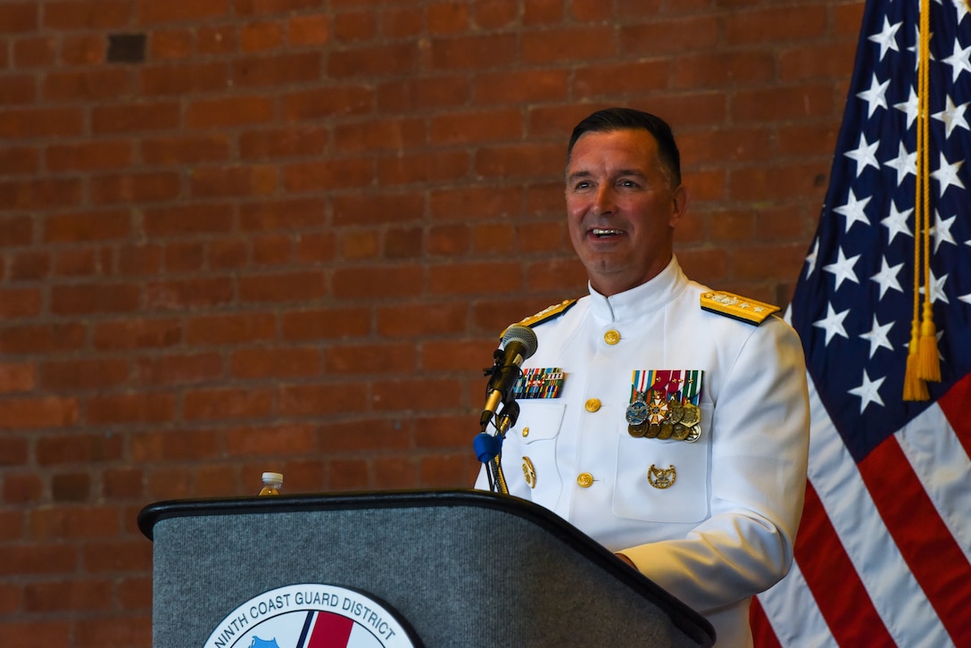 Rear Adm. Hickey speaking at change of command ceremony