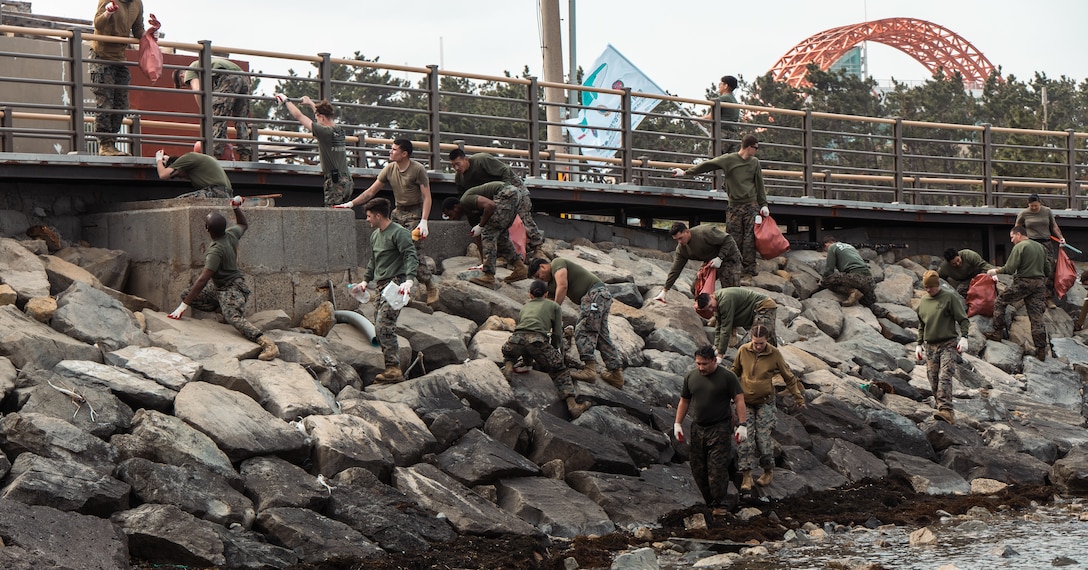 U.S. Marines clean the shoreline during a beach cleanup at Homigot Square, South Korea, on March 24, 2023. To help combat pollution, U.S. Marines, Republic of Korea Marines and Sailors, and local organizations across South Korea came together to clean the beach to promote friendship and work together towards a common goal.