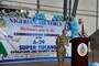 A man in a military uniform speaks at a podium