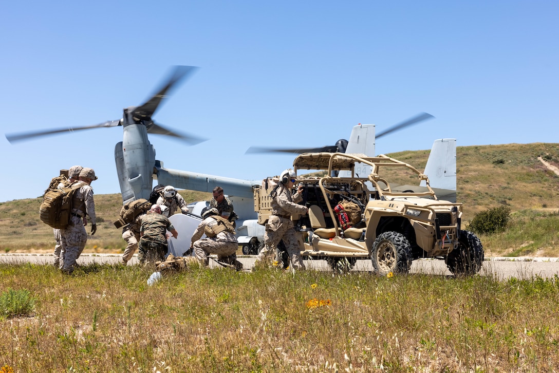 U.S. Marines with Marine Air Control Group 38, 3rd Marine Aircraft Wing, load a utility task vehicle during a command and control training event, part of a final exercise of Weapons and Tactics Instructor (WTI) course 2-23, at Camp Pendleton, California, April 21, 2023. WTI is a seven-week training event hosted by Marine Aviation Weapons and Tactics Squadron One, providing standardized advanced tactical training and certification of unit instructor qualifications to support Marine aviation training and readiness, and assists in developing and employing aviation weapons and tactics. (U.S. Marine Corps photo by Lance Cpl. Padilla)
