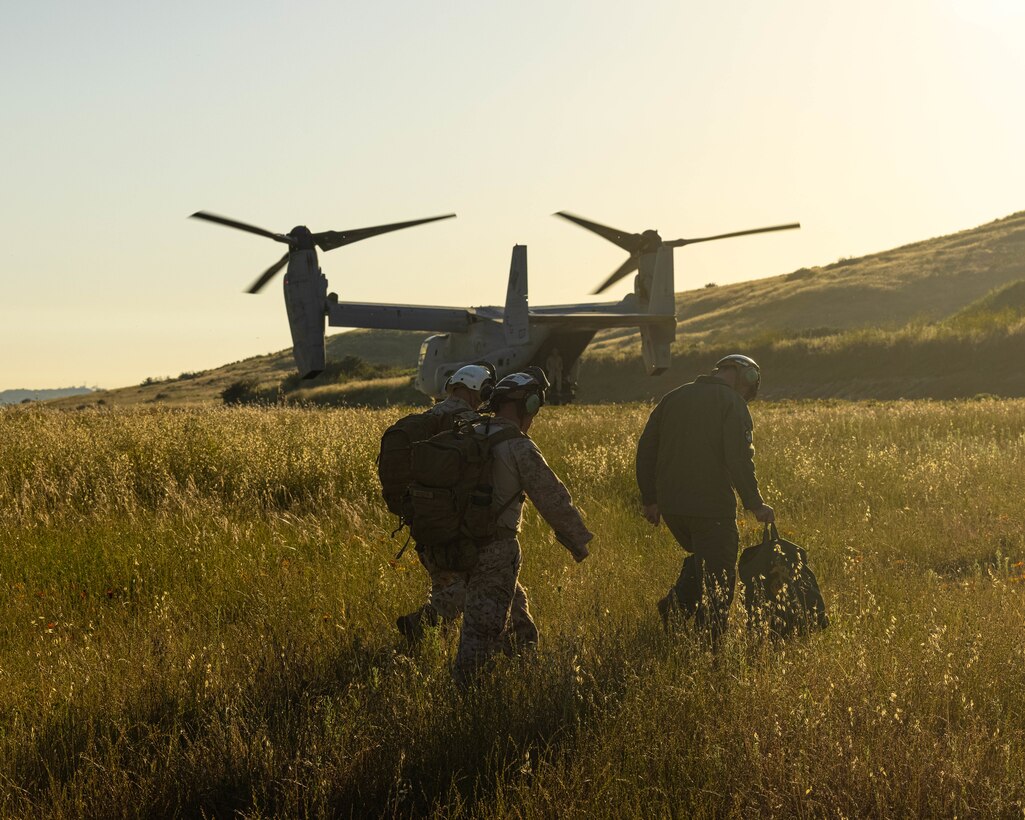 U.S. Marines with Marine Air Control Group 38, 3rd Marine Aircraft Wing, board a Marine Corps MV-22B Osprey helicopter during a command and control training event, part of a final exercise of Weapons and Tactics Instructor (WTI) course 2-23, at Camp Pendleton, California, April 21, 2023. WTI is a seven-week training event hosted by Marine Aviation Weapons and Tactics Squadron One, providing standardized advanced tactical training and certification of unit instructor qualifications to support Marine aviation training and readiness, and assists in developing and employing aviation weapons and tactics. (U.S. Marine Corps photo by Lance Cpl. Padilla)