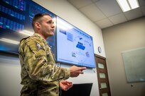 Man in uniform giving brief