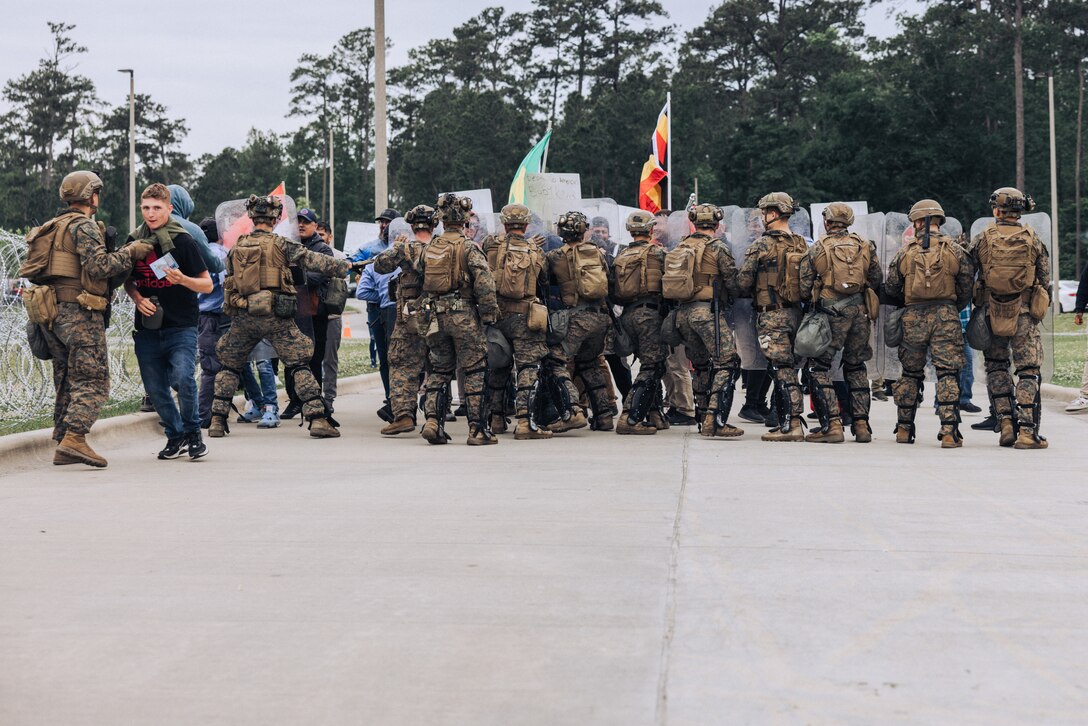 U.S. Marines with the 26th Marine Expeditionary Unit utilize crowd control techniques during a Noncombatant Evacuation Operation (NEO) as part of Amphibious Ready Group/MEU Exercise (ARGMEUEX) at Stone Bay, North Carolina, April 25, 2023. NEOs assist the U.S. Department of State with the evacuation of citizens and approved personnel from a foreign nation to an appropriate safe haven. The 26th Marine Expeditionary Unit is underway with the Bataan ARG conducting ARGMEUEX. (U.S. Marine Corps photo by Cpl. Kyle Jia)