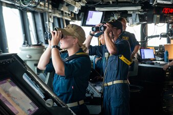 FUJAIRAH, United Arab Emirates (April 25, 2023) Cdr. Christopher Danley right, executive officer of the guided-missile destroyer USS Paul Hamilton (DDG 60), and Ensign Nicole Bucci left overlook sea-and-anchor detail on the bridge of the Paul Hamilton, April 25, 2023 in Fujairah, United Arab Emirates.