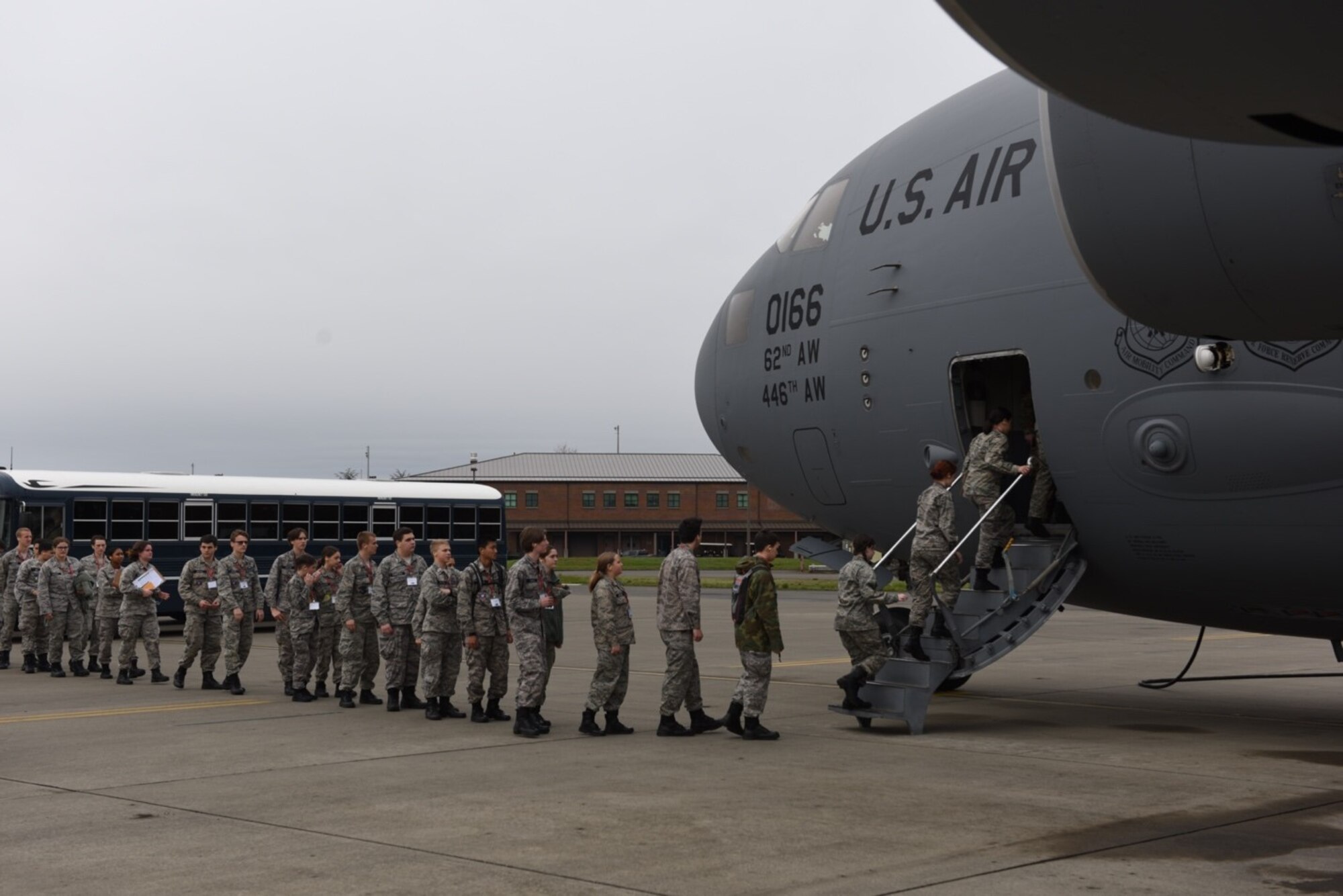 Washington Civil Air Patrol cadets board a C-17 Globemaster III assigned to the 62d Airlift Wing during an incentive flight as part of an installation tour April 22, 2023 at Joint Base Lewis-McChord, Washington. The Civil Air Patrol is a congressionally chartered, nonprofit corporation and  operates as an auxiliary to the Air Force and performs three primary services: Cadet Programs, Aerospace Education, and Emergency Services. (U.S. Air Force photo by Tech. Sgt. Benjamin Sutton)