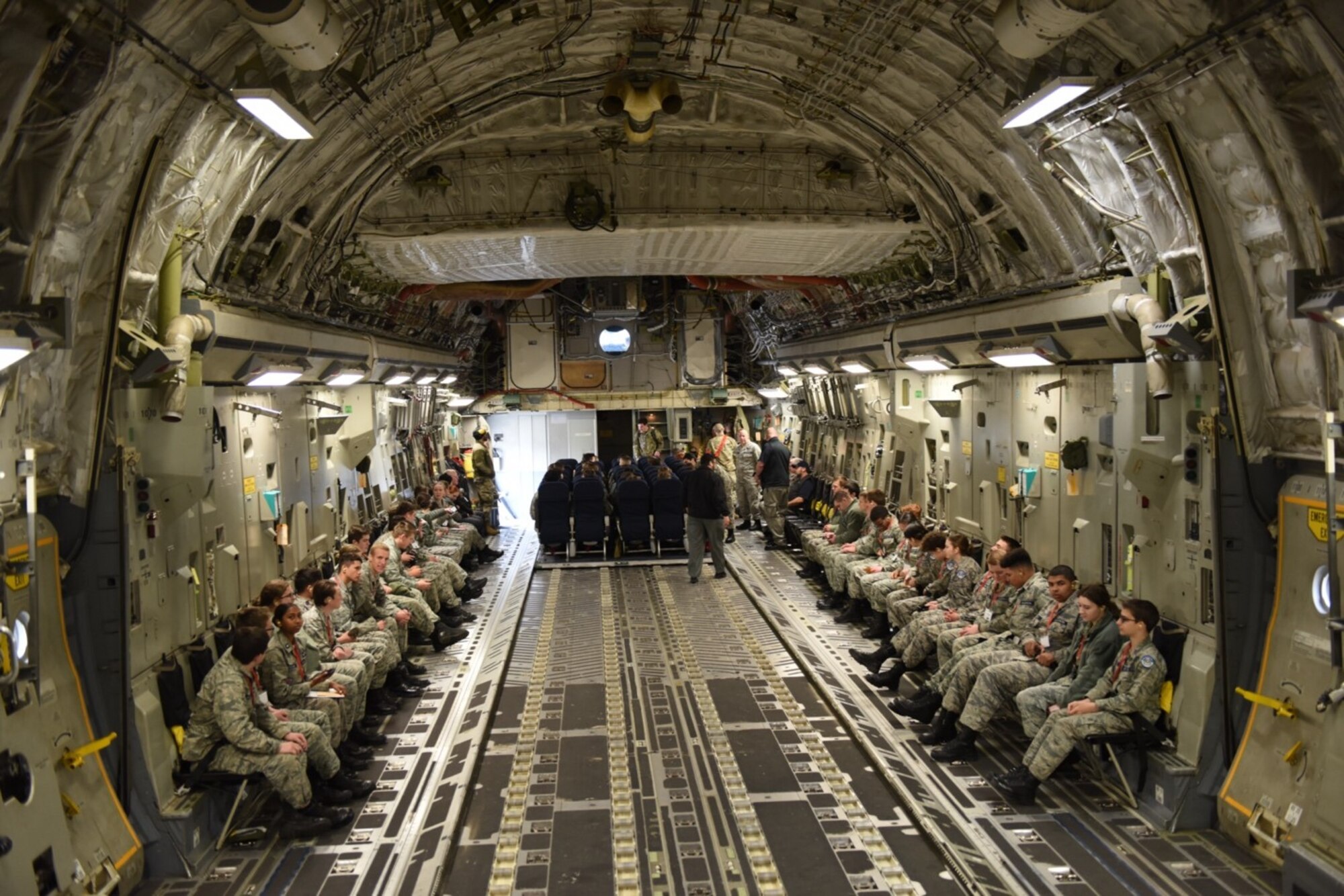 Washington Civil Air Patrol cadets prepare for takeoff onboard a C-17 Globemaster III assigned to the 62d Airlift Wing during an incentive flight as part of an installation tour April 22, 2023 at Joint Base Lewis-McChord, Washington. The Cadet Programs target youth aged 12-20 and educate them in leadership, aerospace, fitness and character development. (U.S. Air Force photo by Tech. Sgt. Benjamin Sutton)