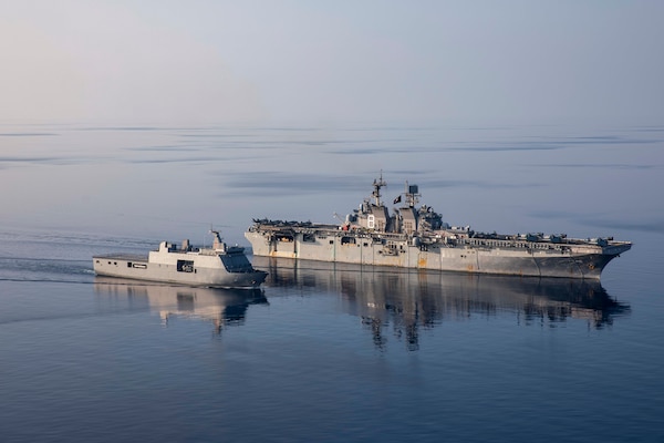 Amphibious assault ship USS Makin Island (LHD 8), right, transits alongside Philippine navy ship BRP Tarlac (FF 601), during a replenishment-at-sea rehearsal for Balikatan 23, April 15, 2023 in the Philippines territorial waters. Balikatan is an annual exercise between the Armed Forces of the Philippines and U.S. military designed to strengthen bilateral interoperability, capabilities, trust, and cooperation built over decades of shared experiences. The Makin Island Amphibious Ready Group, comprised of Makin Island and amphibious transport docks USS Anchorage (LPD 23) and USS John P. Murtha (LPD 26), is operating in the U.S. 7th Fleet area of operations with the embarked 13th Marine Expeditionary Unit to enhance interoperability with Allies and partners and serve as a ready-response force to defend peace and maintain stability in the Indo-Pacific region. (U.S. Navy photo by Mass Communication Specialist 3rd Class Kendra Helmbrecht)
