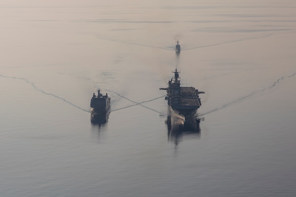 Amphibious assault ship USS Makin Island (LHD 8), right, transits with Philippine navy ships BRP Tarlac (FF 601), left, and BRP Jose Rizal (FF 150) during a replenishment-at-sea rehearsal for Balikatan 23, April 15, 2023 in the Philippines territorial waters. Balikatan is an annual exercise between the Armed Forces of the Philippines and U.S. military designed to strengthen bilateral interoperability, capabilities, trust, and cooperation built over decades of shared experiences. The Makin Island Amphibious Ready Group, comprised of Makin Island and amphibious transport docks USS Anchorage (LPD 23) and USS John P. Murtha (LPD 26), is operating in the U.S. 7th Fleet area of operations with the embarked 13th Marine Expeditionary Unit to enhance interoperability with Allies and partners and serve as a ready-response force to defend peace and maintain stability in the Indo-Pacific region. (U.S. Navy photo by Mass Communication Specialist 3rd Class Kendra Helmbrecht)