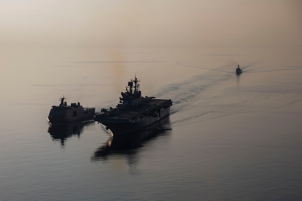 Amphibious assault ship USS Makin Island (LHD 8), right, transits with Philippine navy ships BRP Tarlac (FF 601), left, and BRP Jose Rizal (FF 150) during a replenishment-at-sea rehearsal for Balikatan 23, April 15, 2023 in the Philippines territorial waters. Balikatan is an annual exercise between the Armed Forces of the Philippines and U.S. military designed to strengthen bilateral interoperability, capabilities, trust, and cooperation built over decades of shared experiences. The Makin Island Amphibious Ready Group, comprised of Makin Island and amphibious transport docks USS Anchorage (LPD 23) and USS John P. Murtha (LPD 26), is operating in the U.S. 7th Fleet area of operations with the embarked 13th Marine Expeditionary Unit to enhance interoperability with Allies and partners and serve as a ready-response force to defend peace and maintain stability in the Indo-Pacific region. (U.S. Navy photo by Mass Communication Specialist 3rd Class Kendra Helmbrecht)