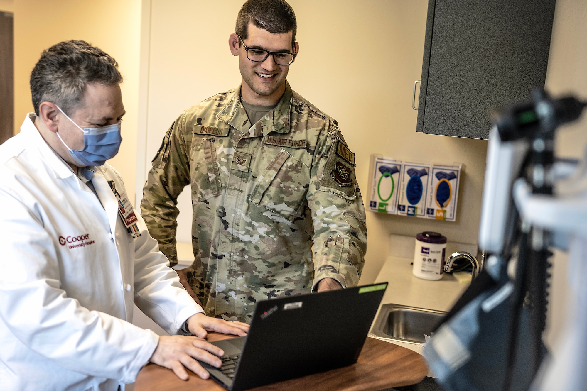 A photograph of military and civilian healthcare providers.