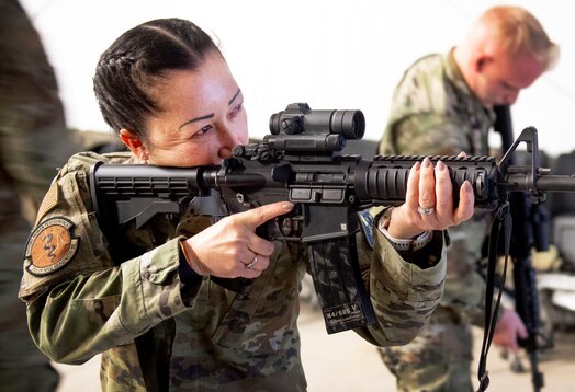  SCHRIEVER SPACE FORCE BASE, Colo. -- Master Sgt. Mary Jo Devall, 21st Medical Group prepares to use the Schriever SFB firearms training simulator during a training event April 21.  The event was a part of the "Connecting Airmen and Guardians to the Mission" initiative implemented by senior enlisted leaders. (U.S. Space Force Photo by Dennis Rogers)