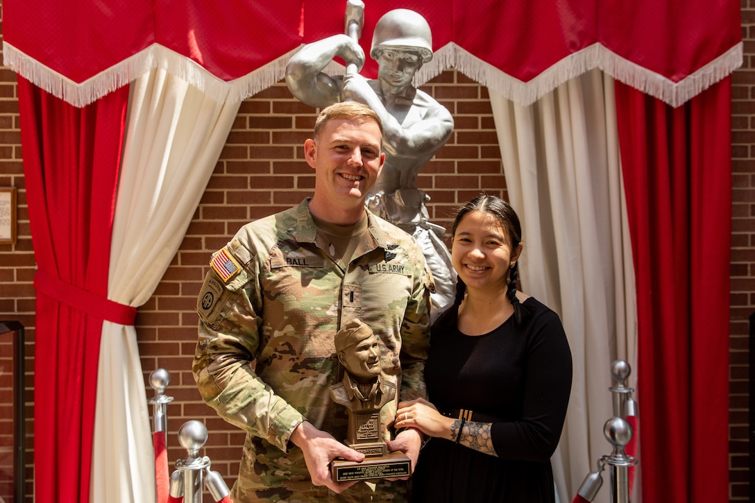 U.S. Army 1st Lt. Jason Bell poses with his wife, Dr. Michelle Baltam, after receiving the Lt. Orville Munson Award at the U.S. Army Engineer Regimental School at Fort Leonardwood, Missouri on April 28, 2023. The award is given annually to honor an engineer lietuenant or warrant officer platoon leader in the Active Army and Army National Guard in recognition of outstanding contributions to military engineering by demonstrated technical and leadership ability. (U.S. Army National Guard photo by Sgt. 1st Class Andrew Dickson)
