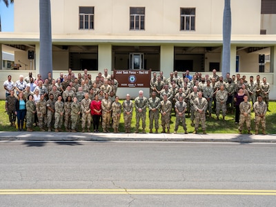 Members of Joint Task Force-Red Hill (JTF-RH) pose for a group photo after a patching ceremony at its headquarters on Ford Island, Hawaii, April 28, 2023.