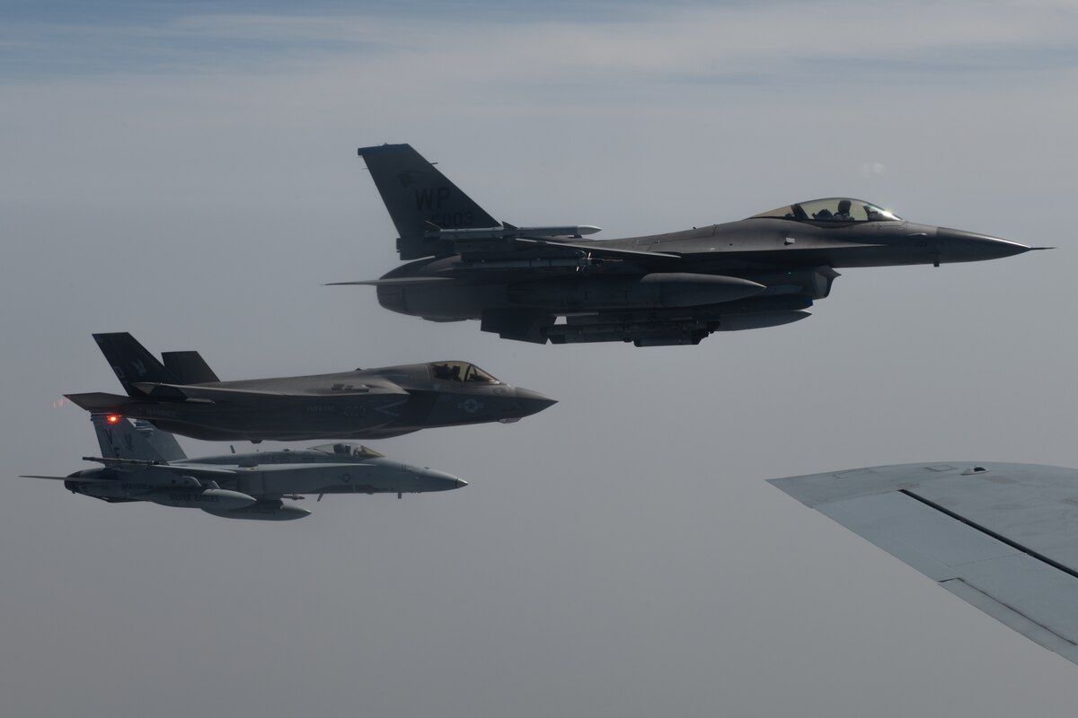 A U.S. Air Force F-16 Fighting Falcon, U.S. Marine Corps F-35B Lightning II and U.S. Marine Corps F/A-18 Hornet fly alongside a U.S. Air Force KC-135 Stratotanker during Korea Flight Training Apr. 21, 2023. KFT is a regularly scheduled training event designed to enhance the combat readiness of U.S. and Republic of Korea forces to maintain peace in the region. (U.S. Air Force photo by Senior Airman Cedrique Oldaker)