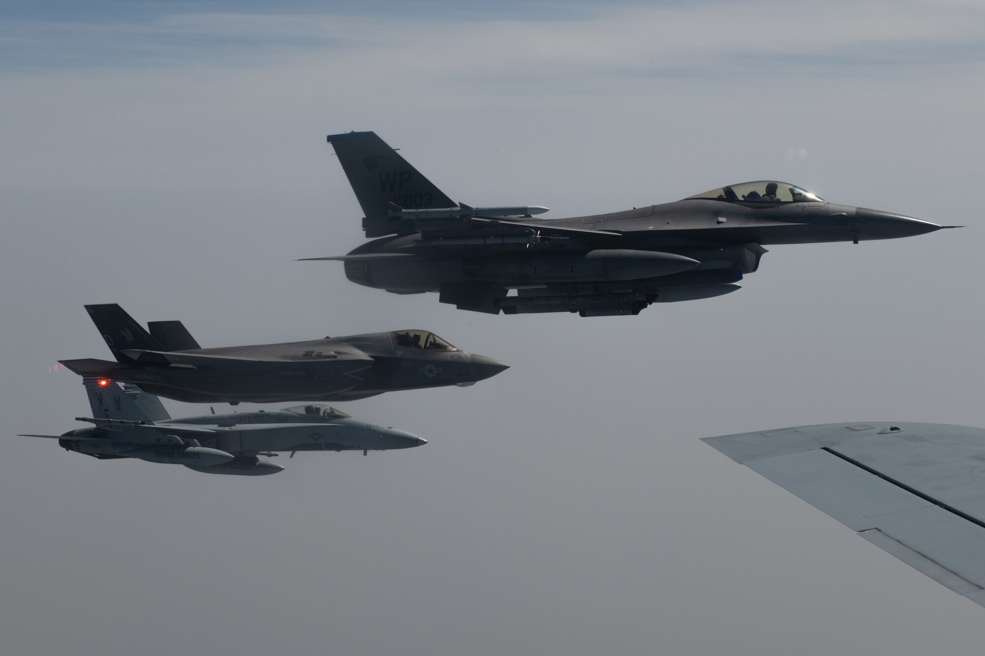 A U.S. Air Force F-16 Fighting Falcon, U.S. Marine Corps F-35B Lightning II and U.S. Marine Corps F/A-18 Hornet fly alongside a U.S. Air Force KC-135 Stratotanker during Korea Flight Training Apr. 21, 2023. KFT is a regularly scheduled training event designed to enhance the combat readiness of U.S. and Republic of Korea forces to maintain peace in the region. (U.S. Air Force photo by Senior Airman Cedrique Oldaker)