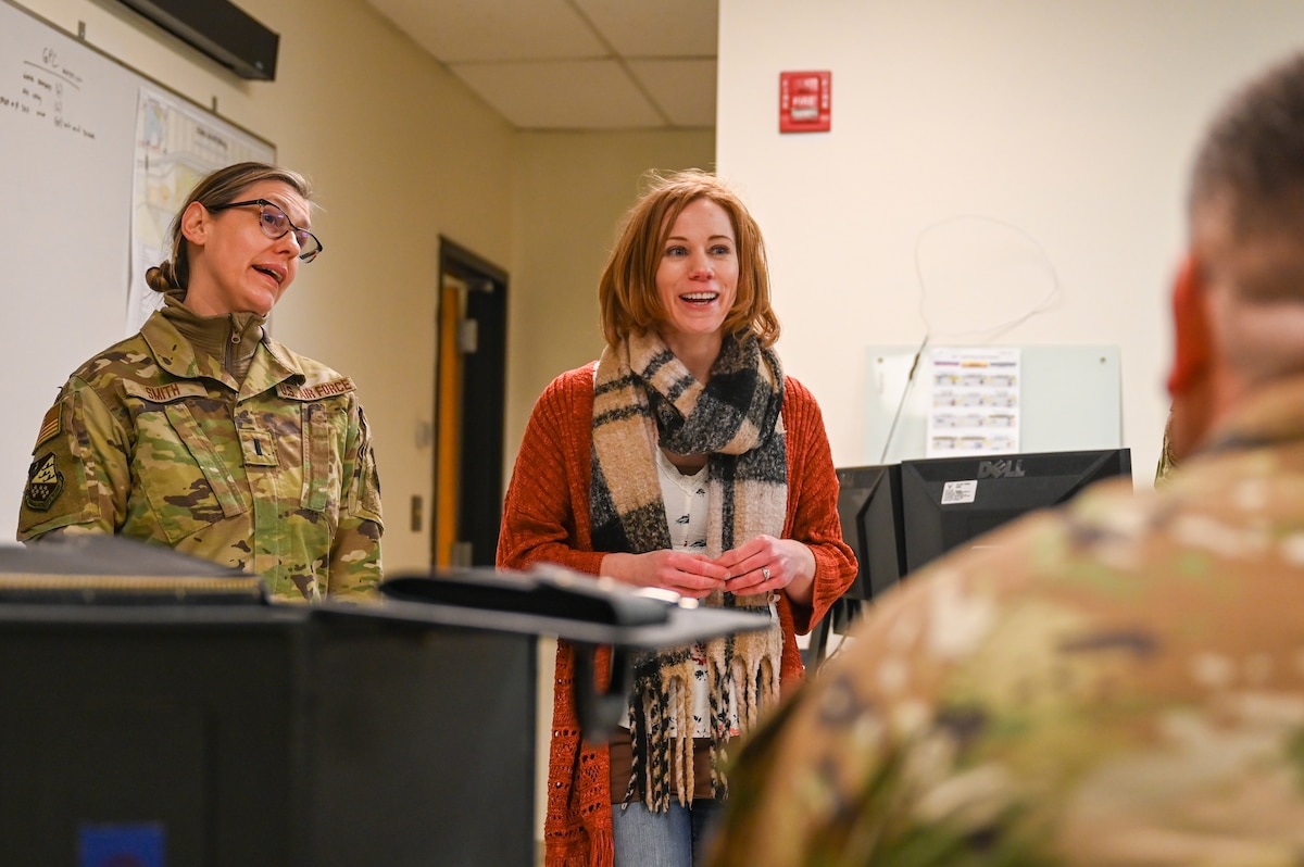 1st Lt. Chayo Smith, the 934th Airlift Wing sexual assault prevention and response victim advocate, left, and Elizabeth Swanson, the 934 AW sexual assault response coordinator, presents a lecture to outgoing deployers, April 2, 2023, at the Minneapolis-Saint Paul Air Reserve Station, Minnesota. This lecture was part of a meet-and-greet for the deployers. (U.S. Air Force photo by Senior Airman Colten Tessness)