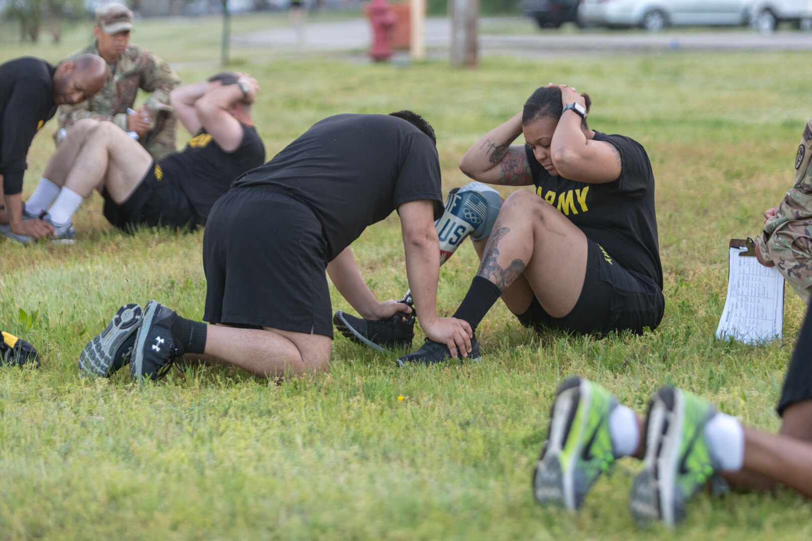 Soldiers do sit-ups.