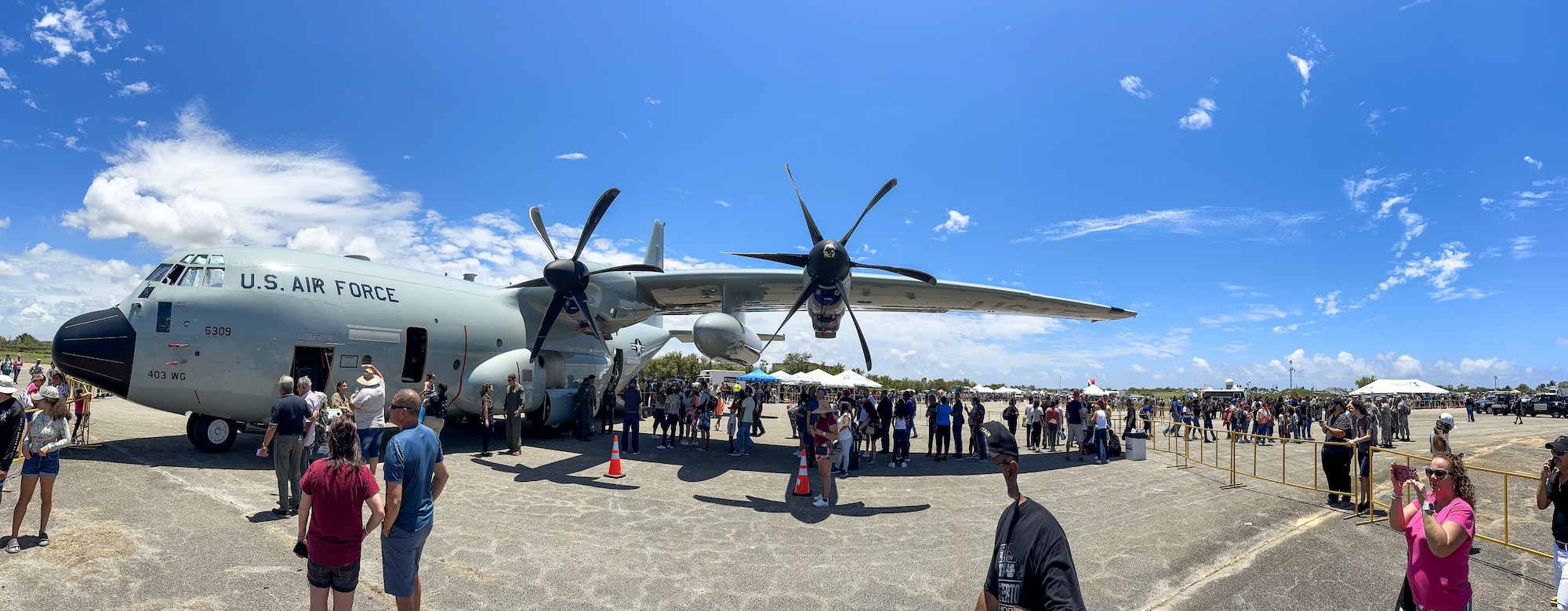 people line up to tour a wc-130j aircraft