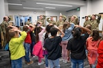 Airmen from Hill Air Force Base play Simon Says with students at South Clearfield Elementary students, Clearfield, Utah, April 18, 2023.