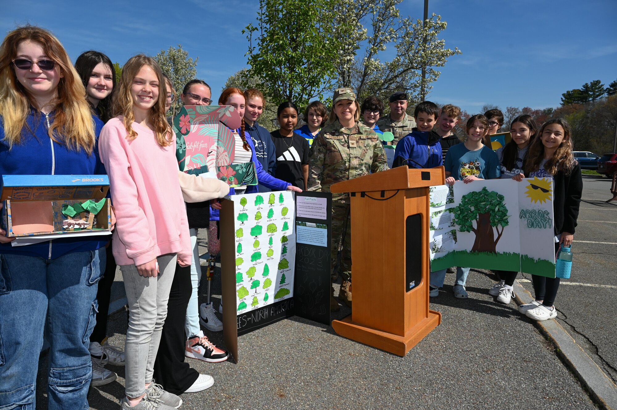 image of people standing around a podium outside