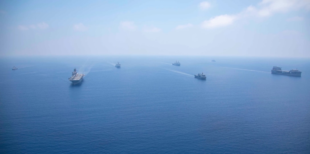 Amphibious assault ship USS Makin Island (LHD 8), amphibious transport docks USS Anchorage (LPD 23) and USS John P. Murtha (LPD 26), expeditionary mobile base USS Miguel Keith (ESB 5), and Philippine navy ships BRP Jose Rizal (FF-150), BRP Gregorio Del Pilar (PS 15), and BRP Tarlac (FF 601) transit the South China Sea for Balikatan 23, April 19, 2023. Balikatan is an annual exercise between the Armed Forces of the Philippines and U.S. military designed to strengthen bilateral interoperability, capabilities, trust, and cooperation built over decades of shared experiences. The Makin Island Amphibious Ready Group, comprised of Makin Island, Anchorage, and John P. Murtha, is operating in the U.S. 7th Fleet area of operations with the embarked 13th Marine Expeditionary Unit to enhance interoperability with Allies and partners and serve as a ready-response force to defend peace and maintain stability in the Indo-Pacific region. (U.S. Navy photo by Mass Communication Specialist 3rd Class Joshua Martinez)
