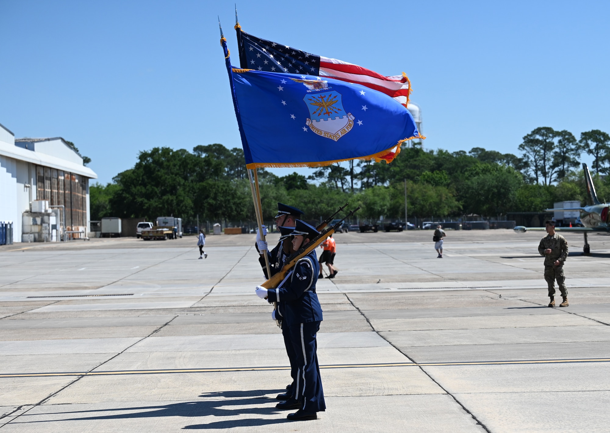 Keesler Honor Guard members display the colors at the STEM Expo on Keesler Air Force Base, Mississippi, April 28, 2023. The Science, Technology, Engineering, and Math Expo was an educational opportunity for student to learn about career opportunities in the Air Force and on the Gulf Coast. (U.S. Air Force photo by Airman 1st Class Elizabeth Davis)