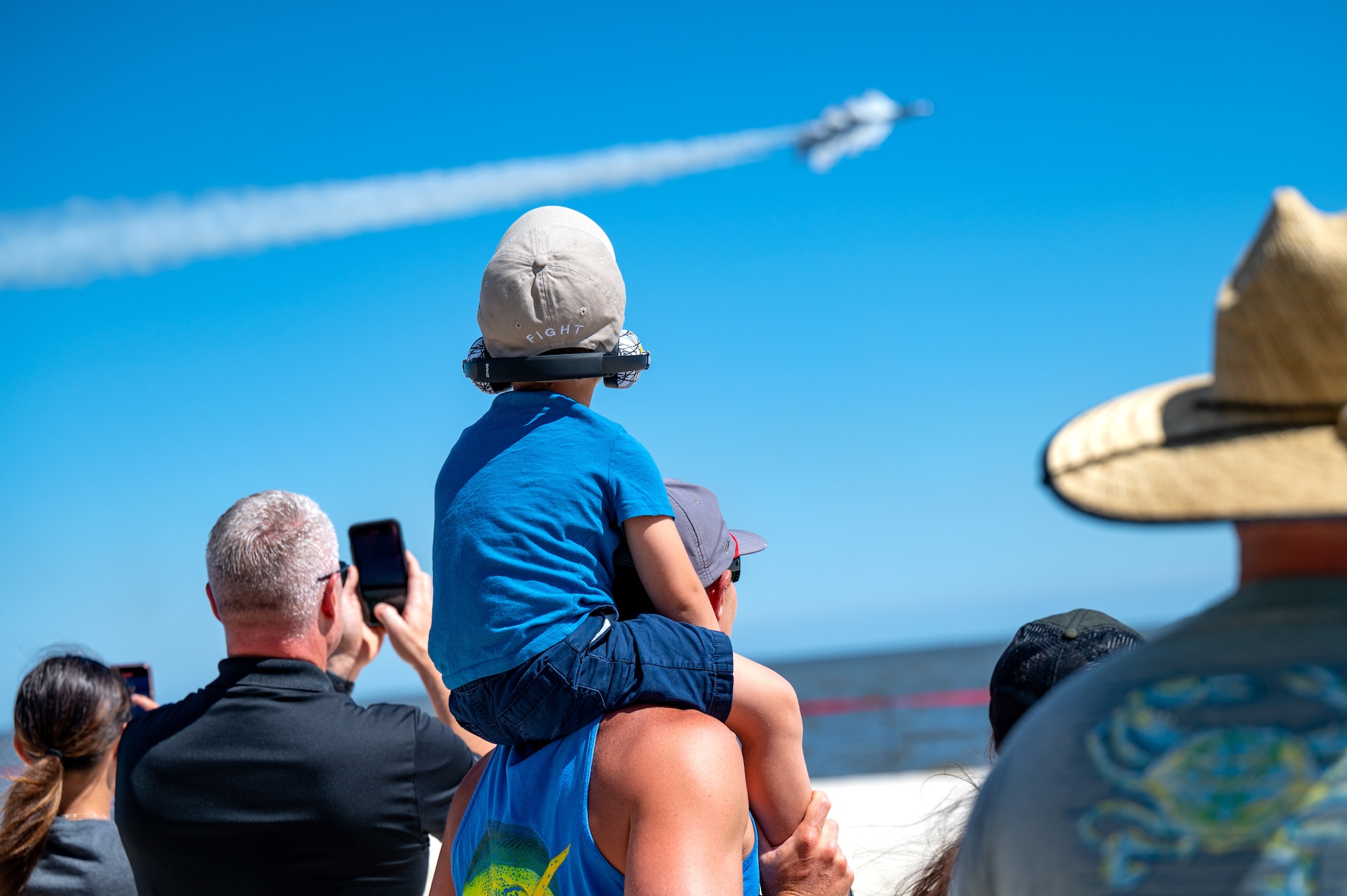 Special Olympics Mississippi athletes and guests watch the Thunderbirds perform a practice session for the 2023 Thunder Over the Sound Air and Space Show at Biloxi Beach in Biloxi, Mississippi, April 28, 2023. Thunder Over the Sound is a unique event where a military installation and its surrounding city jointly host an air show in two locations; Biloxi Beach and Keesler's flightline. (U.S. Air Force photo by Airman 1st Class Trenten Walters)
