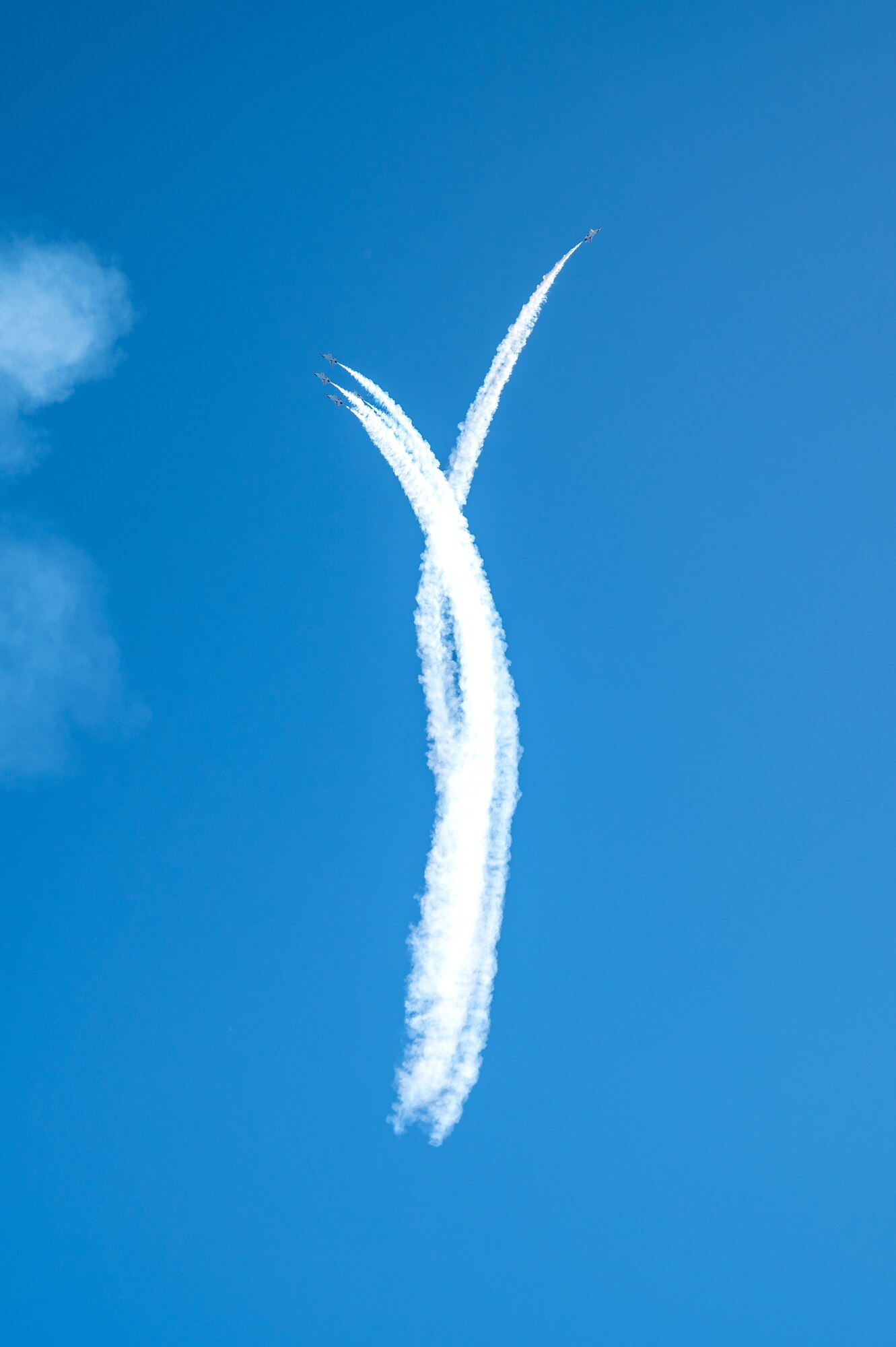 The Thunderbirds perform the high bomb burst maneuver during a practice session for the 2023 Thunder Over the Sound Air and Space Show at Biloxi Beach in Biloxi, Mississippi, April 28, 2023. Thunder Over the Sound is a unique event where a military installation and its surrounding city jointly host an air show in two locations; Biloxi Beach and Keesler's flightline. (U.S. Air Force photo by Airman 1st Class Trenten Walters)