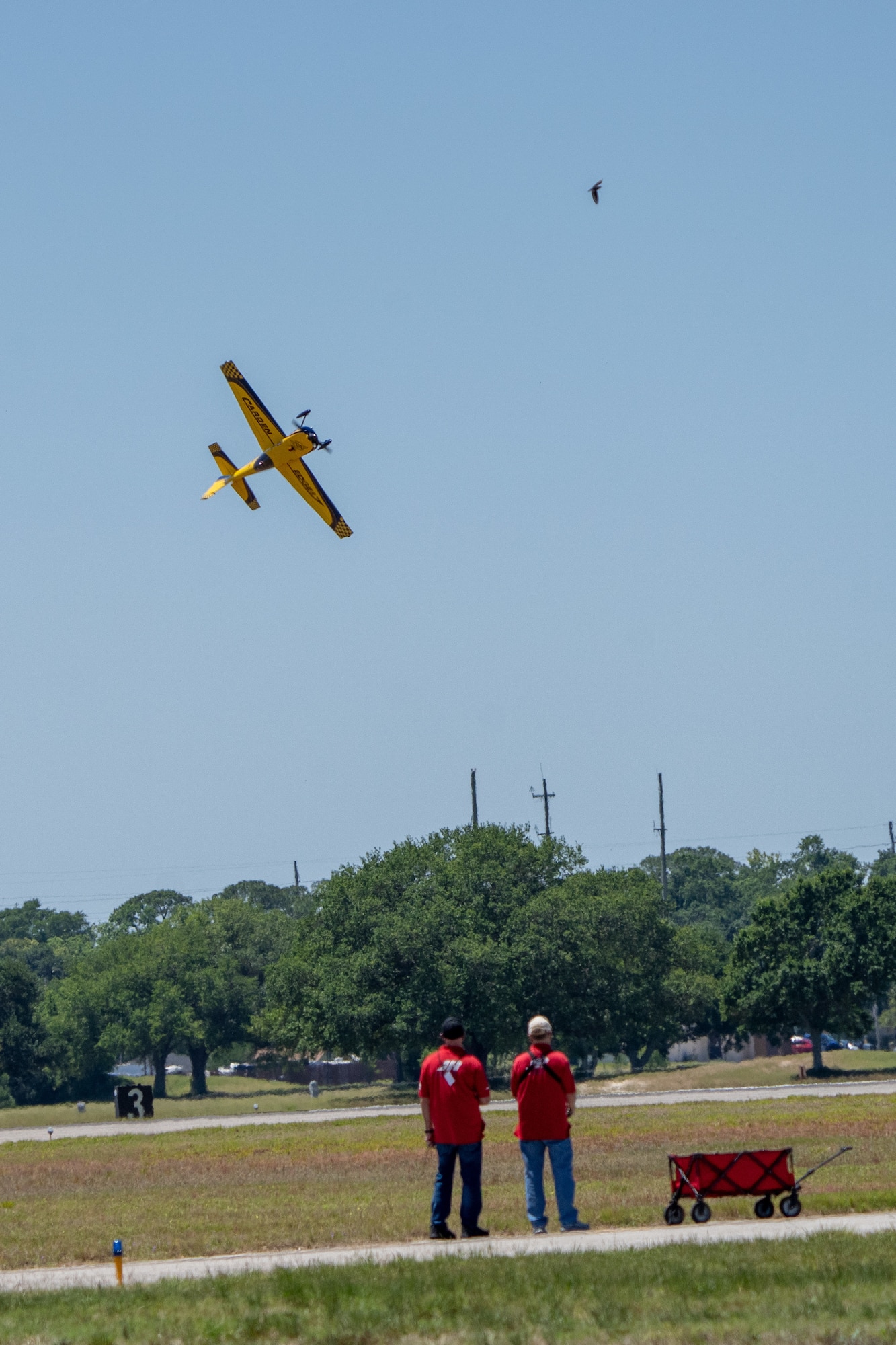 A Radio Controlled Plane is piloted during the 2023 Thunder Over the Sound Air and Space Show at Keesler Air Force Base, Mississippi, April 28, 2023. Thunder Over the Sound is a unique event where a military installation and its surrounding city jointly host an air show in two locations; Biloxi Beach and Keesler's flightline. (U.S. Air Force photo by Airman 1st Class Trenten Walters)