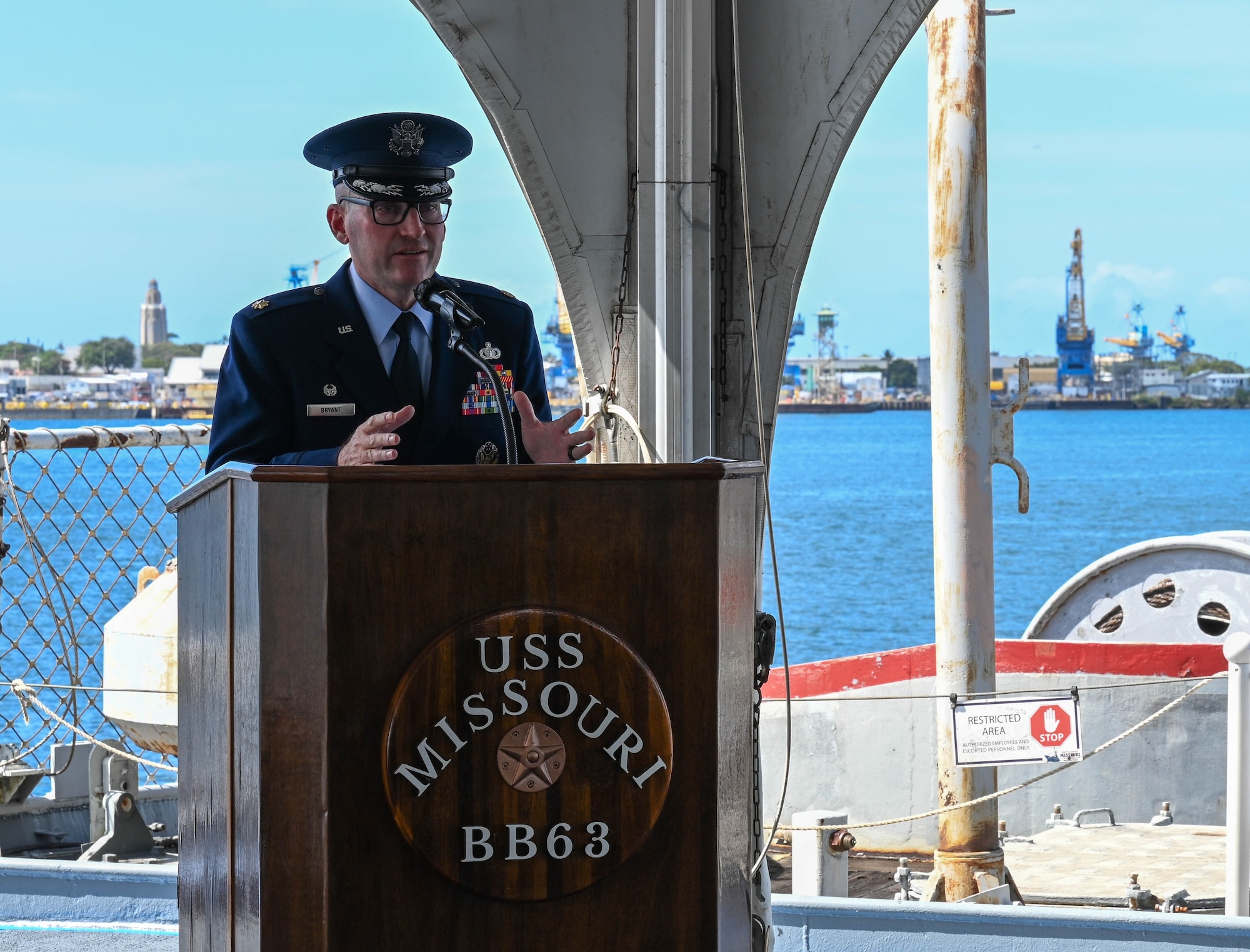 Maj. Michael J. Bryant addresses attendees during OSI's 6th Field Investigations Region assumption of command ceremony on board the historic battleship U.S.S. Missouri at Joint Base Pearl Harbor-Hickam, Hawaii, to standup the 13th Field Investigations Squadron, March 30, 2023. (U.S. Air Force photo by SrA Zoie Cox, 15WG/PA)