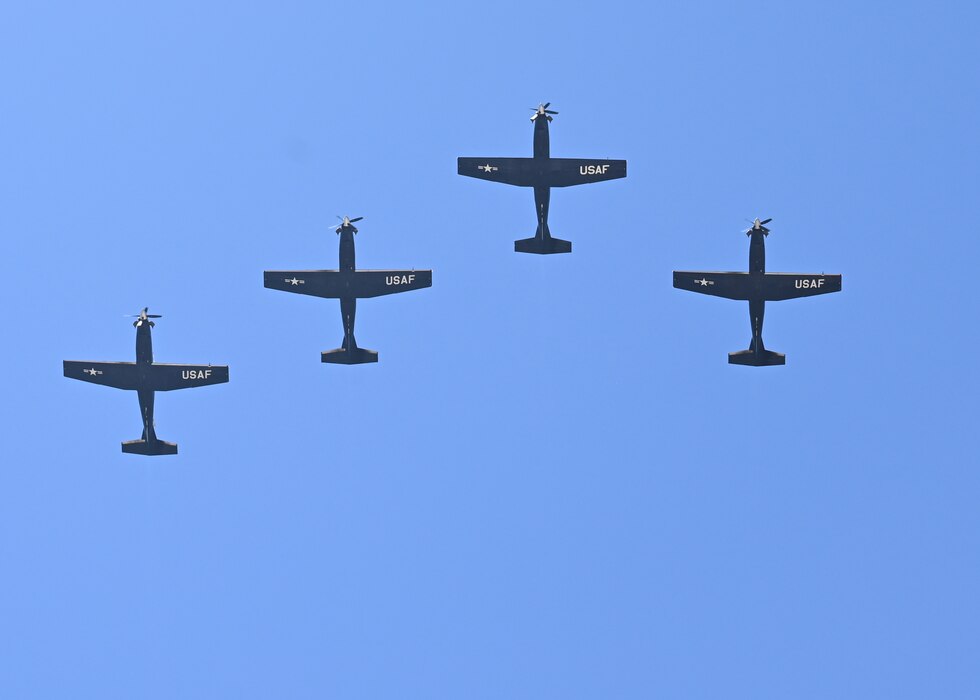 Four T-6 Texans II’s fly over Operation Kids at Goodfellow Air Force Base, Texas, April 29, 2023. The 85th Training Wing and the 47th Operations Support Squadron from Laughlin Air Force Base, Texas supported the flyover. (U.S. Air Force photo by Airman 1st Class Zach Heimbuch)