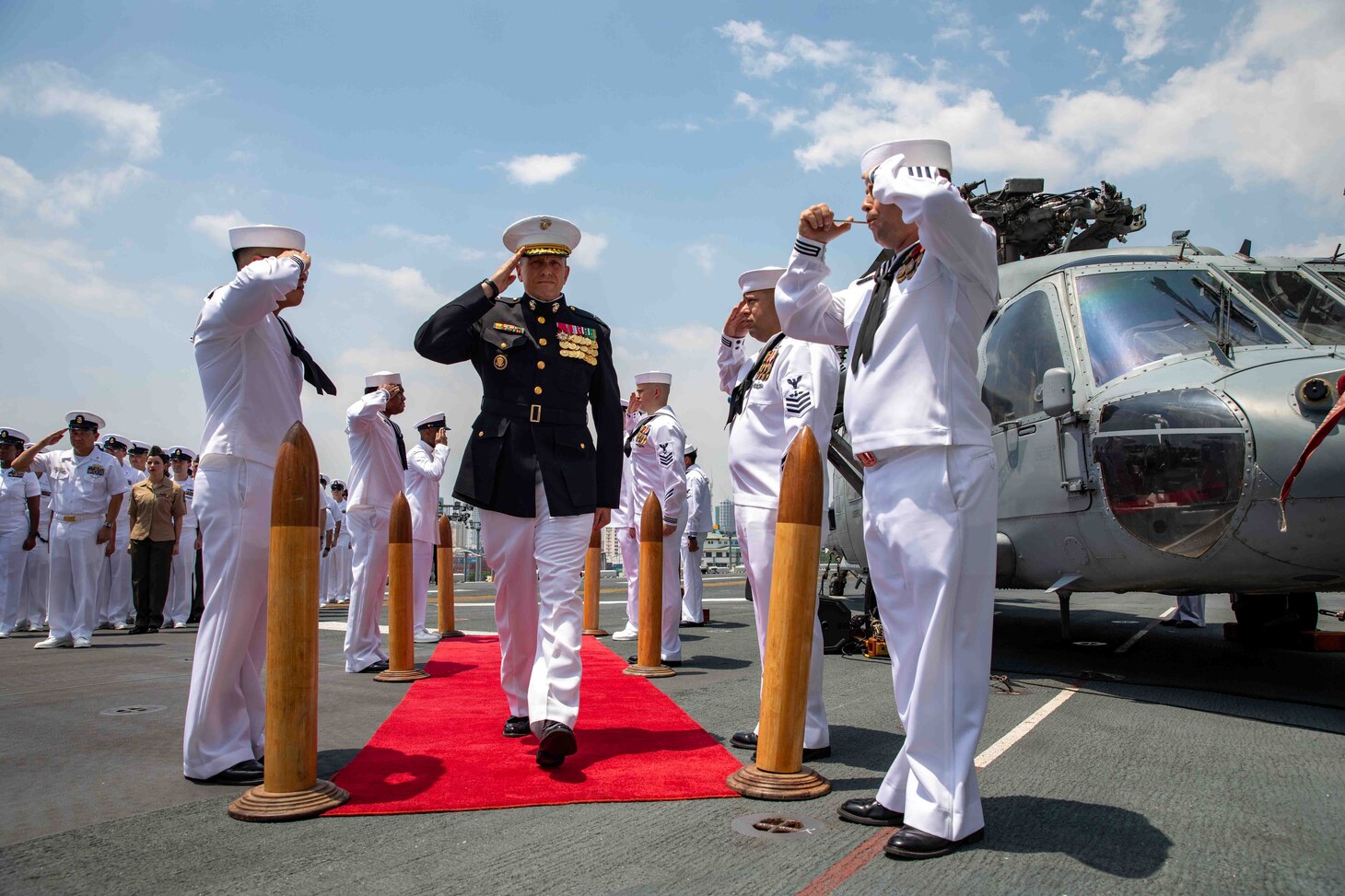 Brig. Gen. Fridrik Fridriksson, commanding general, 3d Marine Expeditionary Brigade, salutes sideboys during a change of command ceremony on the flight deck of amphibious assault ship USS Makin Island (LHD 8), April 28, 2023 in the Philippines. The change of command ceremony is a time-honored naval tradition which formally proclaims the continuity and authority of command to the officers, men and women of the command. The Makin Island Amphibious Ready Group, comprised of Makin Island and amphibious transport dock USS Anchorage (LPD 23) and USS John P. Murtha (LPD 26), is operating in the U.S. 7th Fleet area of operations with the embarked 13th Marine Expeditionary Unit to enhance interoperability with Allies and partners and serve as a ready-response force to defend peace and maintain stability in the Indo-Pacific region.